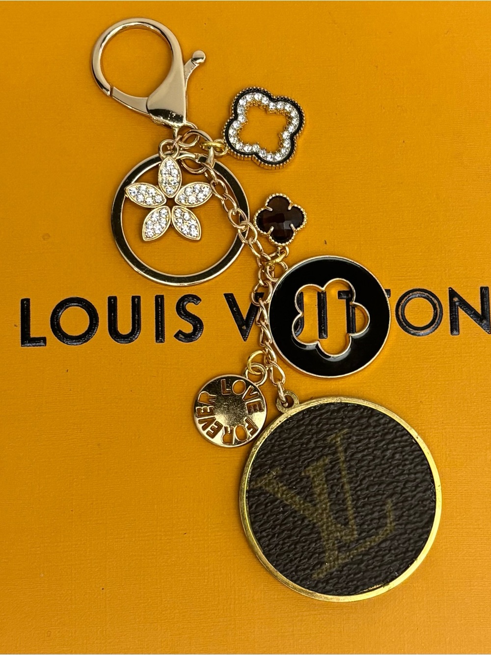 Louis Vuitton Gold-Tone
Monogram Bag Charm, Clover, Rhinestone accents 5.25 in.